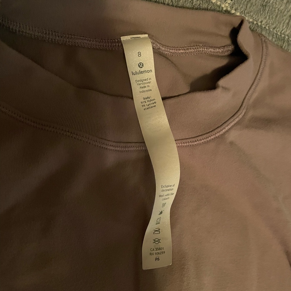 Lululemon pullover. Size 8. Front hits at the waist and back is a little longer
